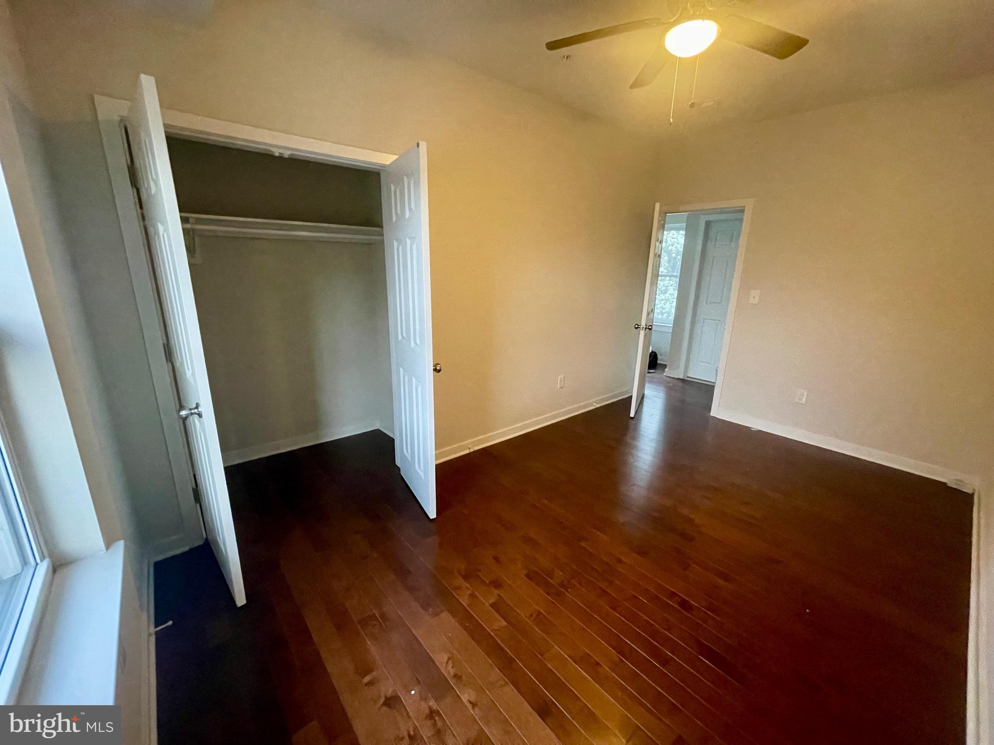 8618 Jones Mill Road Chevy Chase, MD 20815 - Photo 25 of 52 an empty room with wooden floor and closet