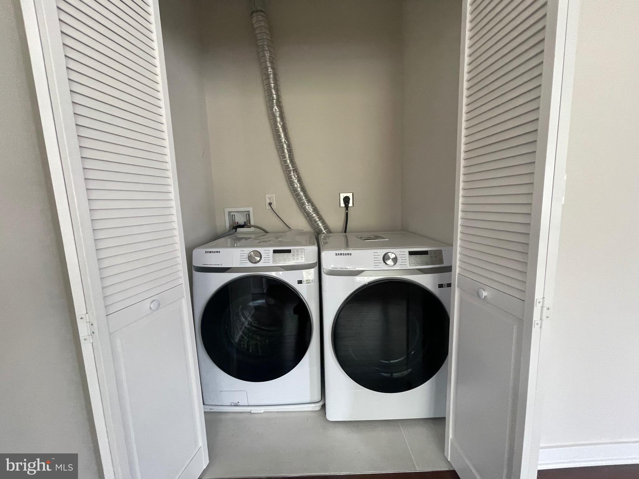 8618 Jones Mill Road Chevy Chase, MD 20815 - Photo 36 of 52 a utility room with dryer and washer