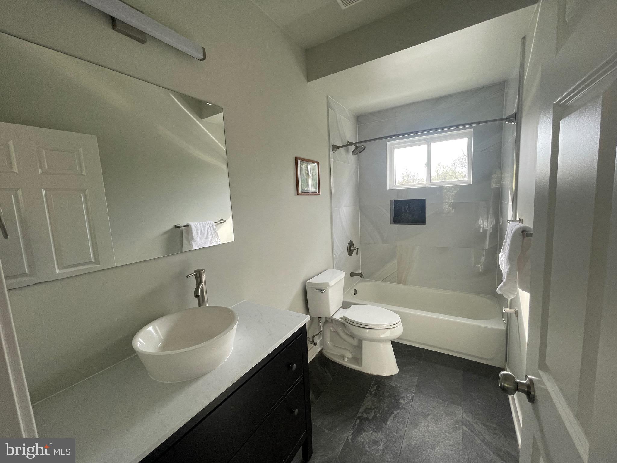 8618 Jones Mill Road Chevy Chase, MD 20815 - Photo 39 of 52 a bathroom with a sink a toilet and shower