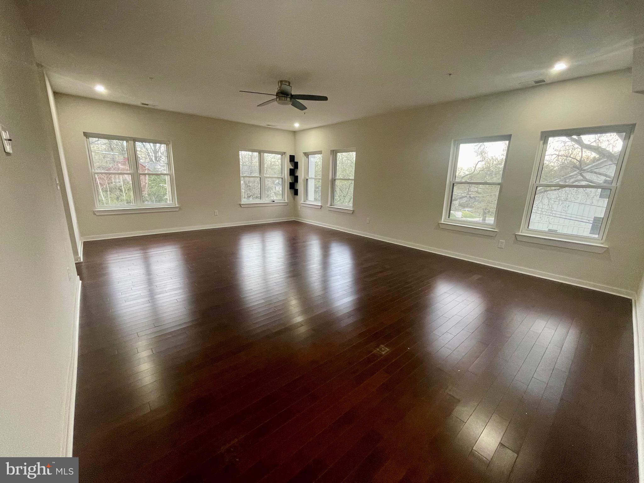 8618 Jones Mill Road Chevy Chase, MD 20815 - Photo 41 of 52 a view of an empty room with wooden floor and a window