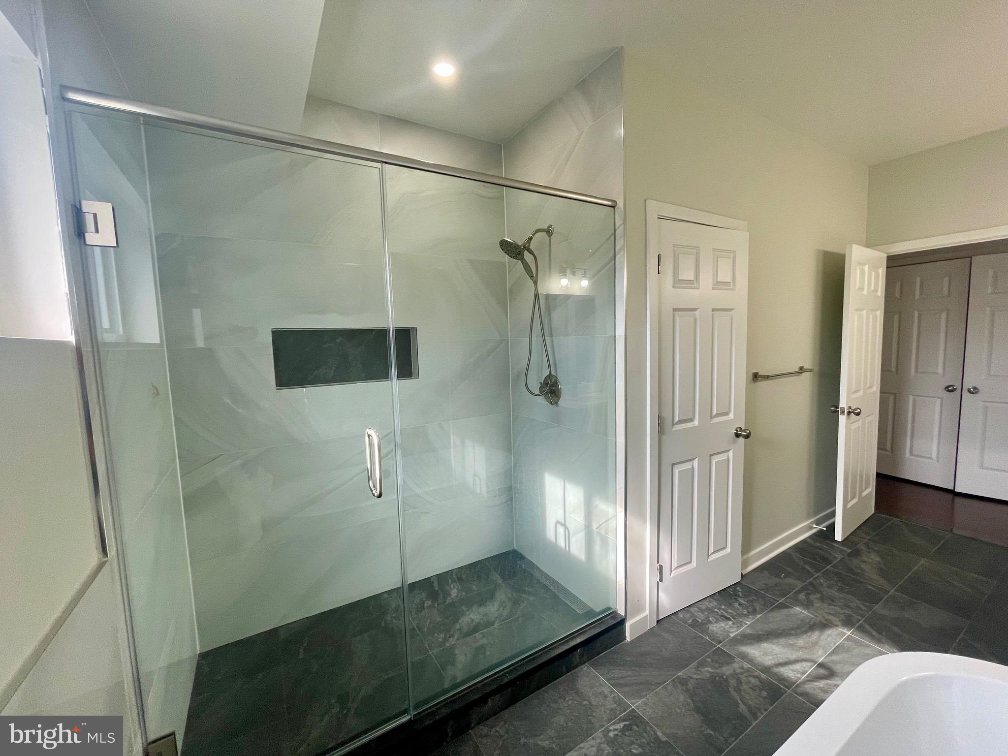 8618 Jones Mill Road Chevy Chase, MD 20815 - Photo 46 of 52 a bathroom with a glass shower door