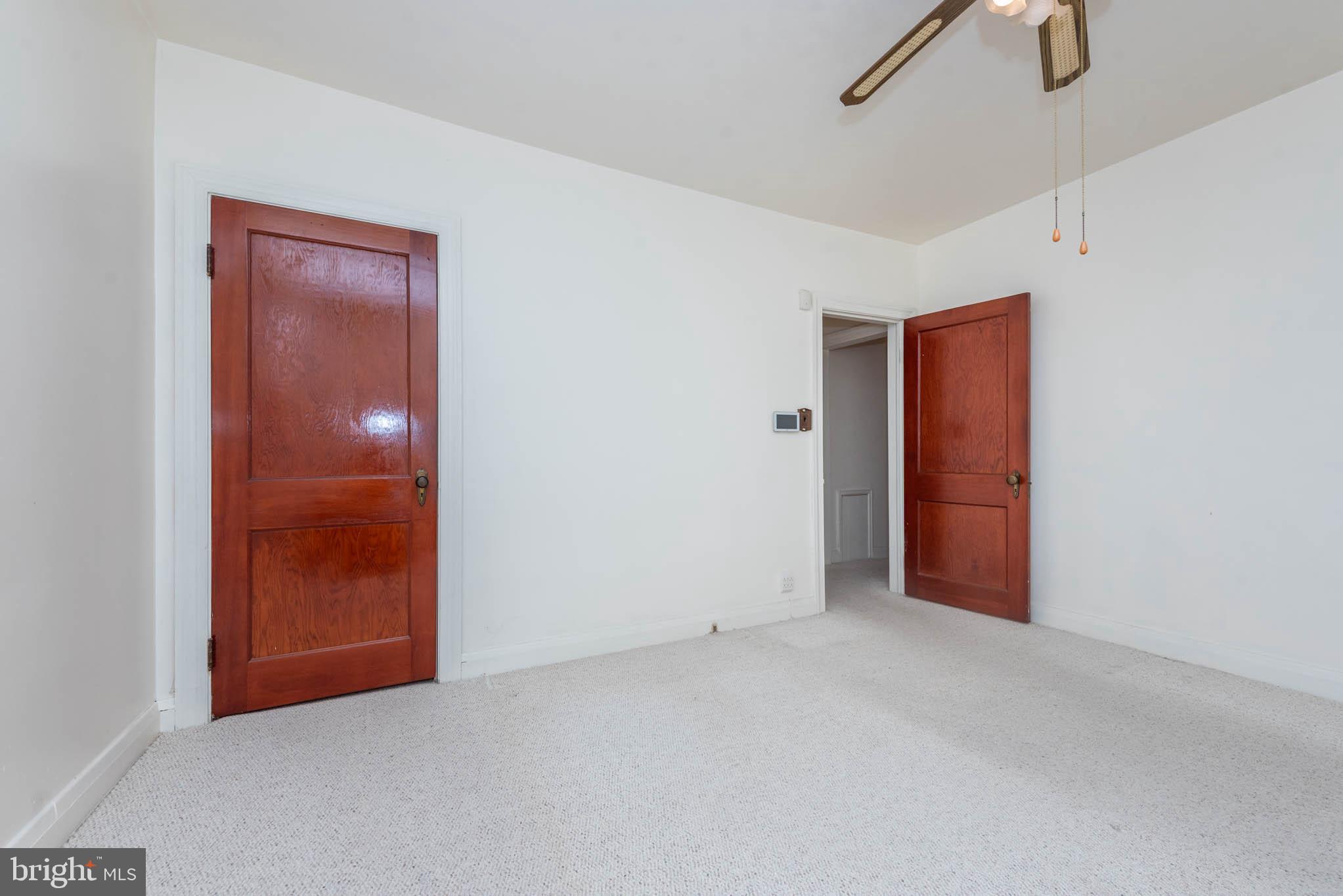 3417 East Joppa Road Baltimore, MD 21234 - Photo 13 of 51 an empty room with closet and mirror