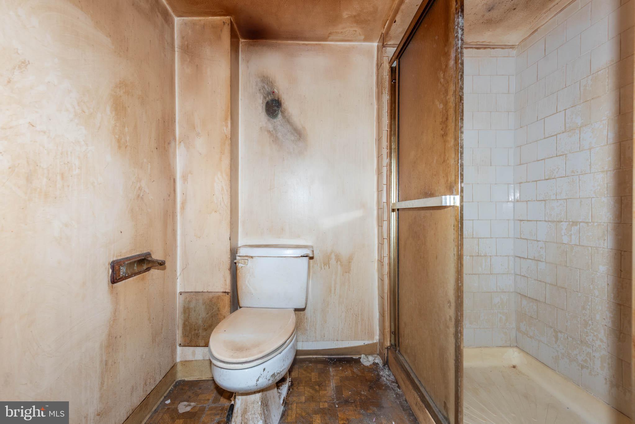 3417 East Joppa Road Baltimore, MD 21234 - Photo 18 of 51 a white toilet sitting next to a bathroom sink