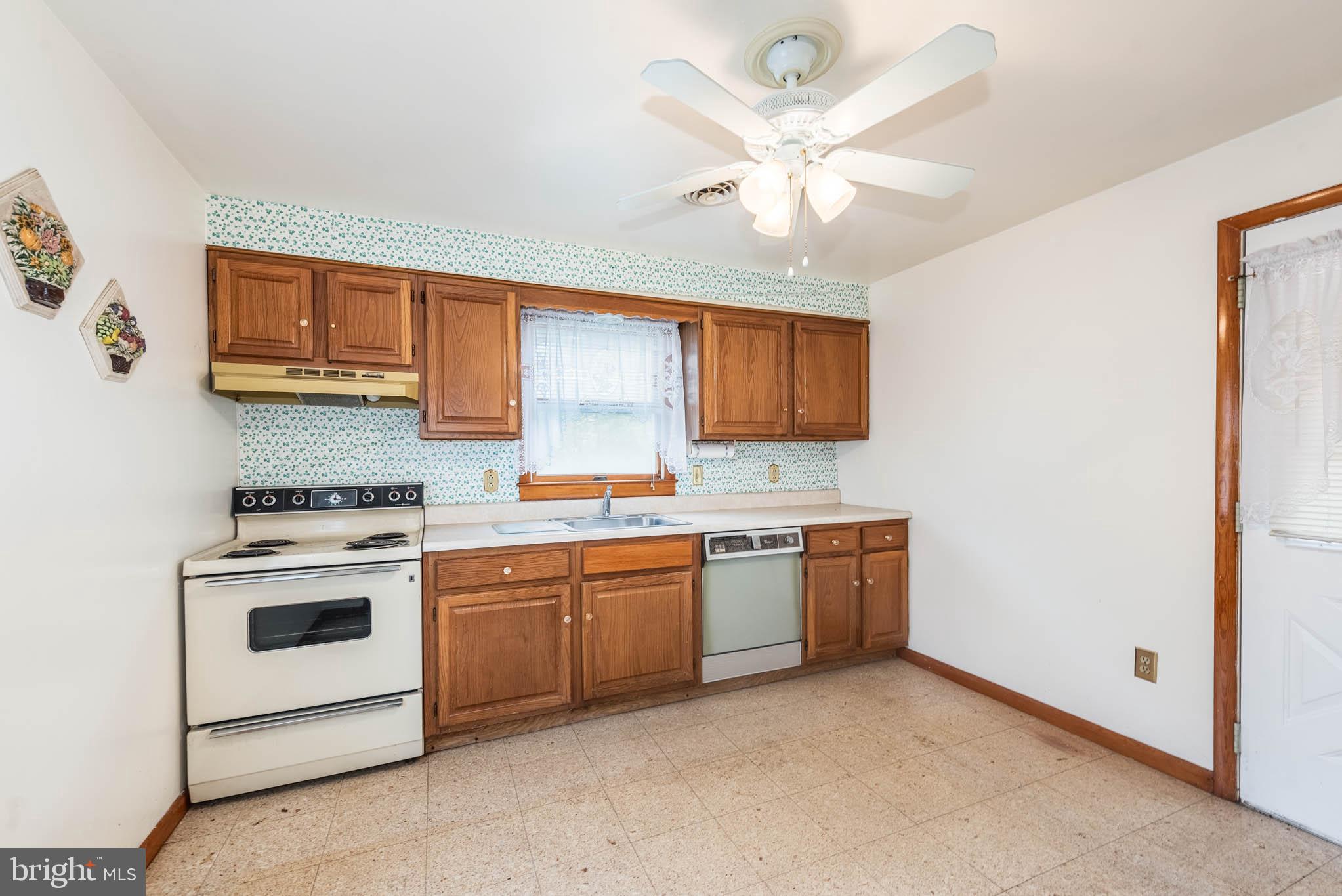 3417 East Joppa Road Baltimore, MD 21234 - Photo 25 of 51 a kitchen with stainless steel appliances granite countertop a stove sink and cabinets