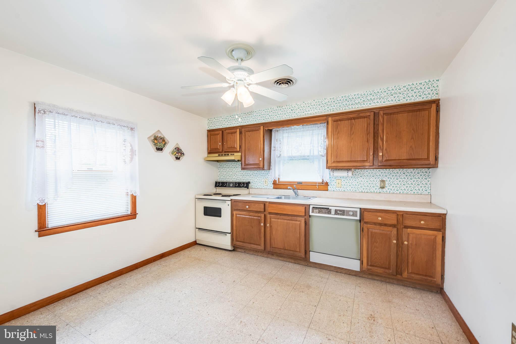 3417 East Joppa Road Baltimore, MD 21234 - Photo 26 of 51 a kitchen with stainless steel appliances granite countertop a stove sink and cabinets