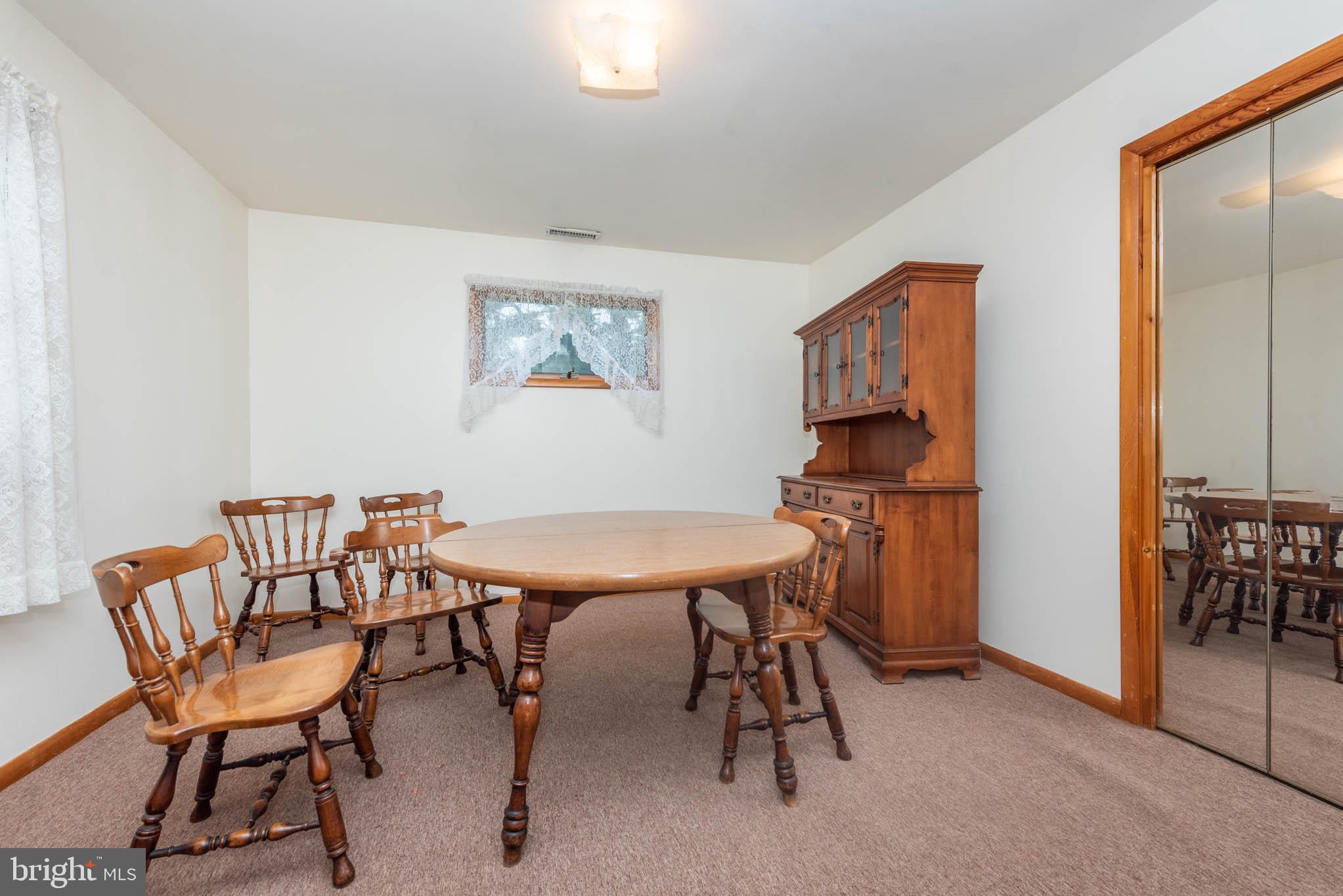 3417 East Joppa Road Baltimore, MD 21234 - Photo 27 of 51 a view of a livingroom with furniture and a dining table
