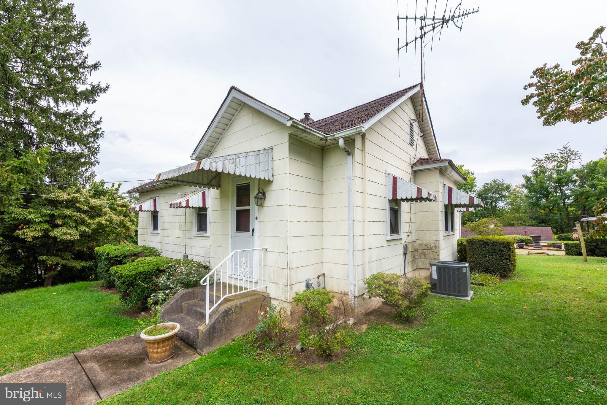 3417 East Joppa Road Baltimore, MD 21234 - Photo 3 of 51 a front view of a house with a yard and seating space