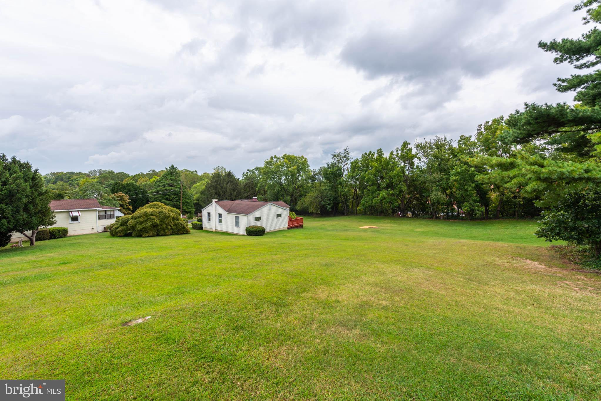 3417 East Joppa Road Baltimore, MD 21234 - Photo 39 of 51 a front view of a house with a yard