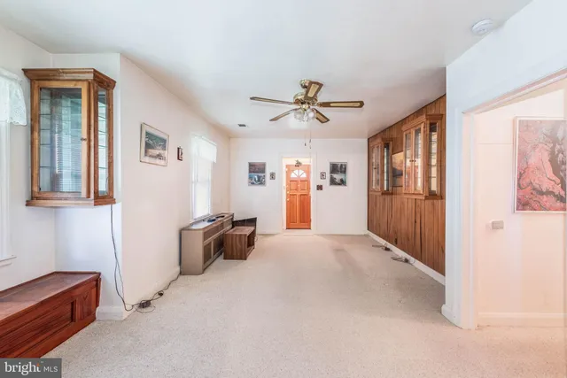 a kitchen with stainless steel appliances kitchen island granite countertop a stove a sink and a refrigerator