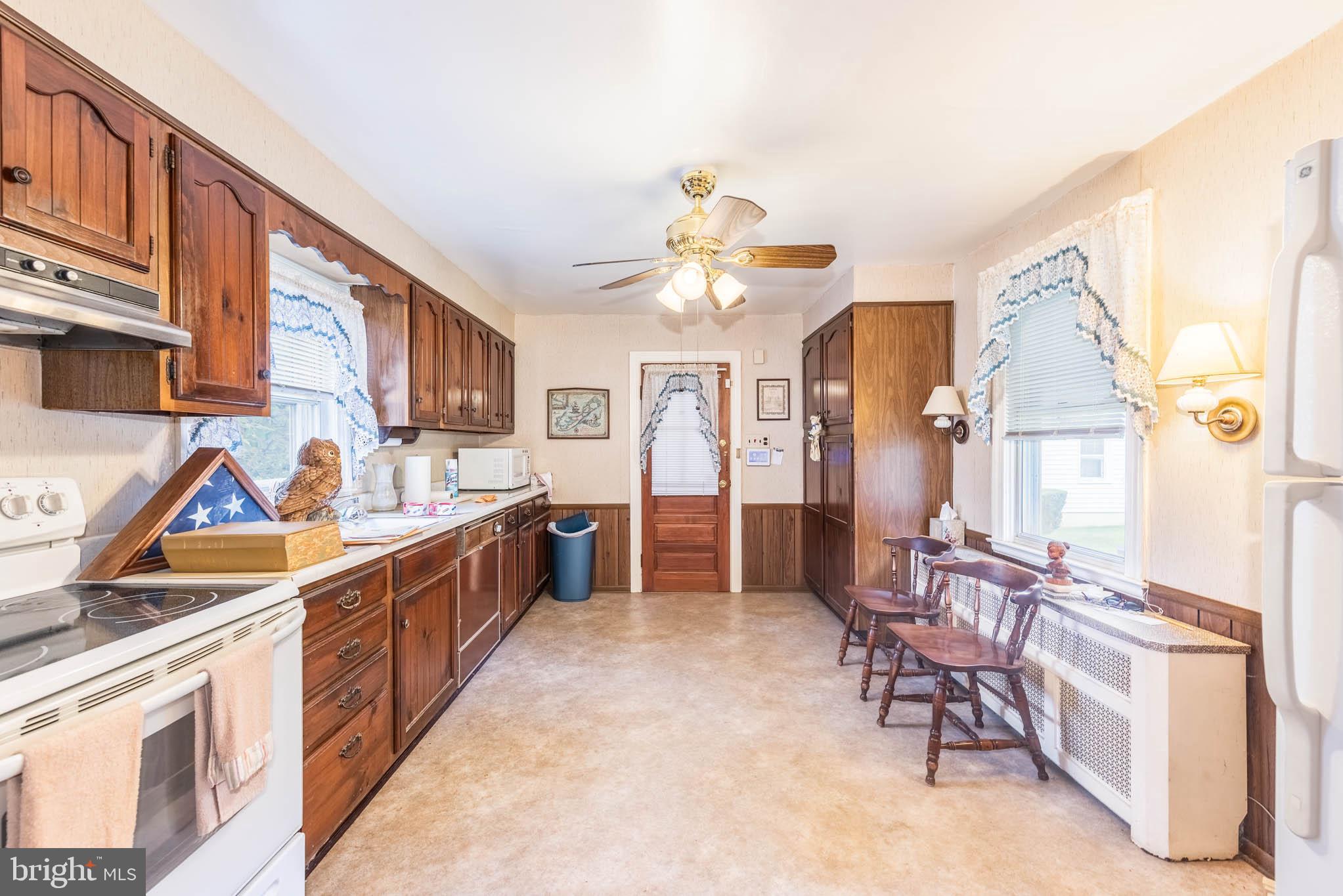 3417 East Joppa Road Baltimore, MD 21234 - Photo 6 of 51 a kitchen with stainless steel appliances kitchen island granite countertop a stove a sink and a refrigerator