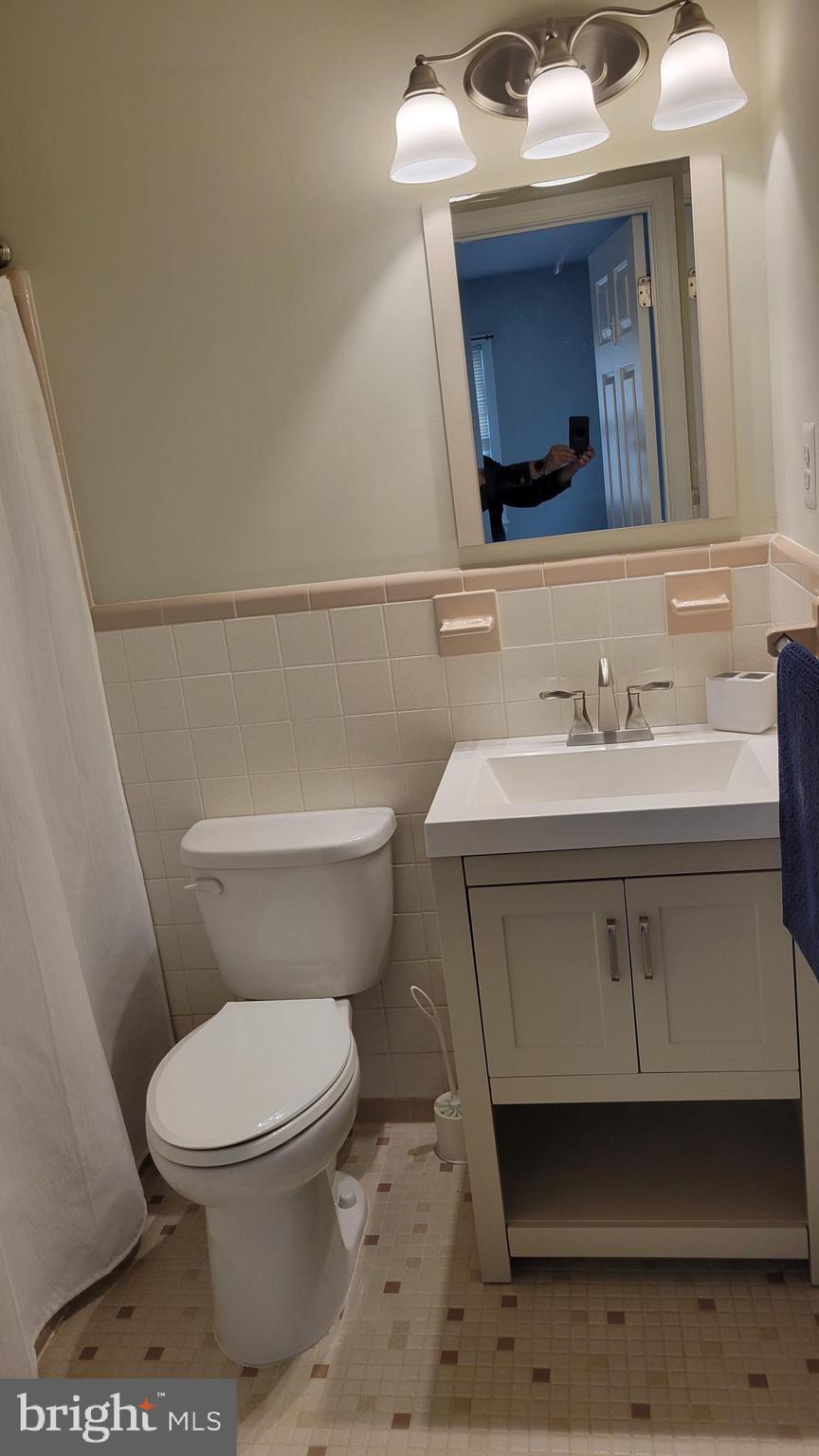29620 Whalen Road Charlotte Hall, MD 20622 - Photo 12 of 16 a bathroom with a sink toilet and mirror