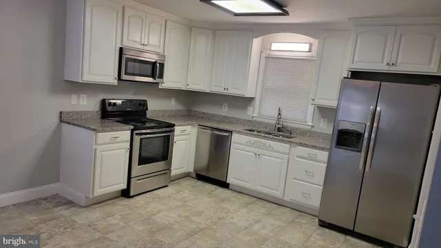 a kitchen with a stove and a microwave