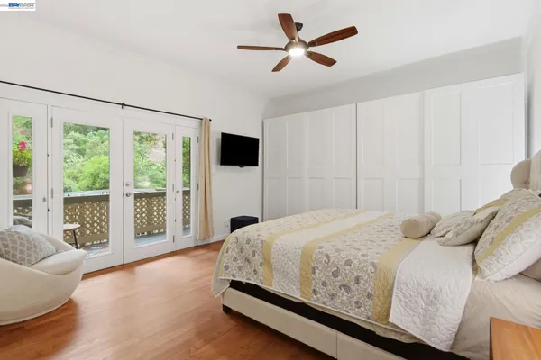 a bedroom with a large bed and a large window