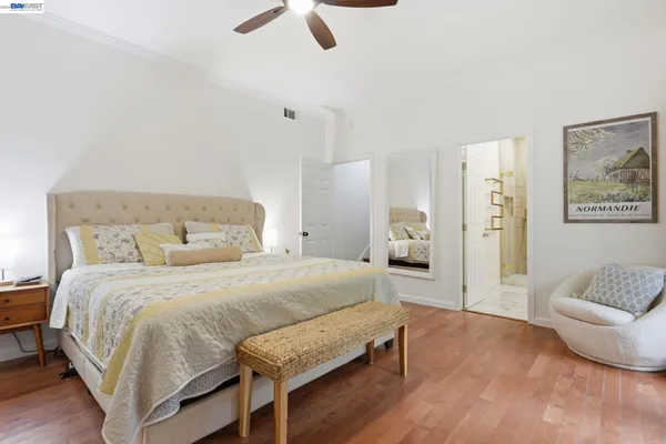 a bedroom with a bed and couch