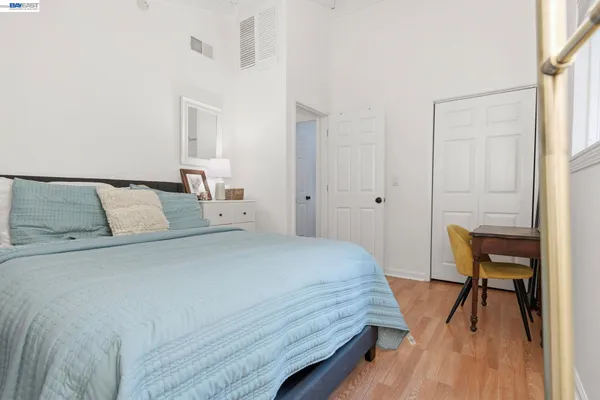 a bedroom with a bed and a table