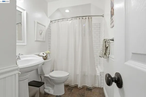a bathroom with a toilet and a sink