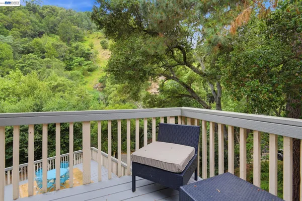 a view of a balcony with wooden floor
