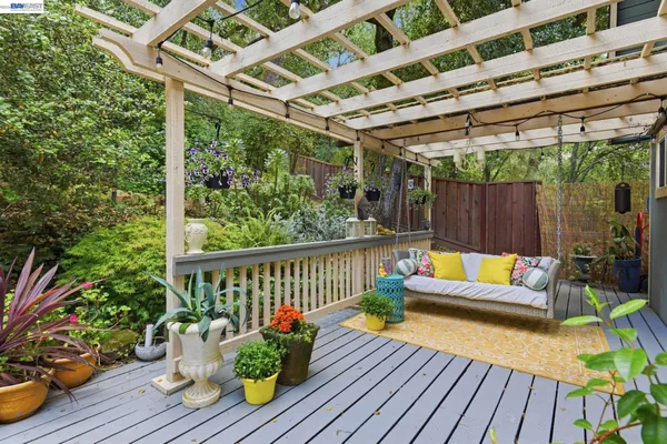 a view of sitting area with furniture and wooden deck