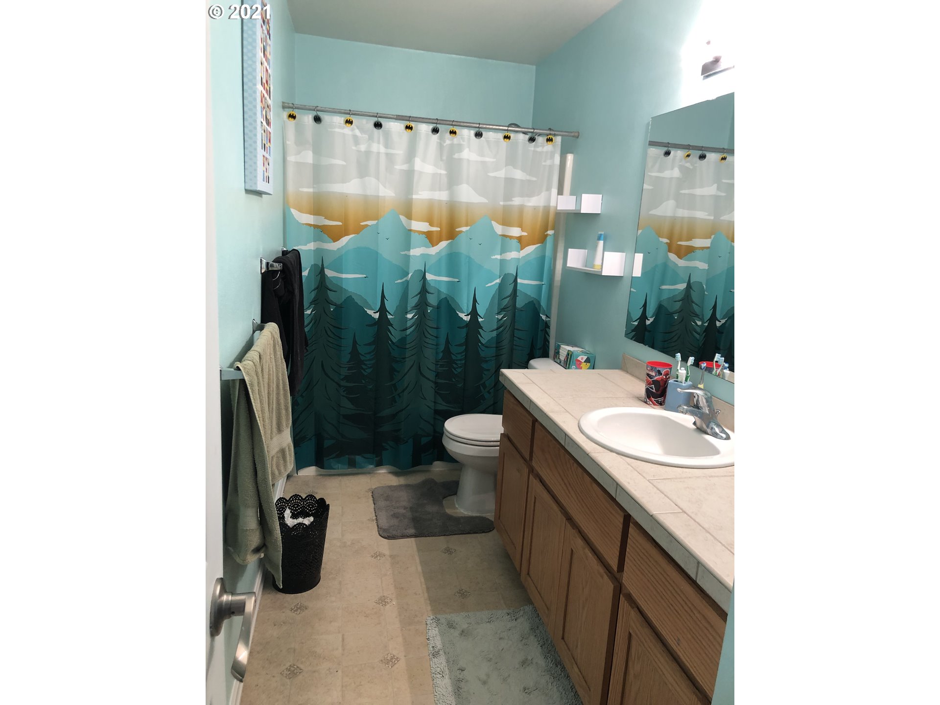 17105 Northeast 13th Place Ridgefield, WA 98642 - Photo 12 of 16 a bathroom with a sink toilet and shower