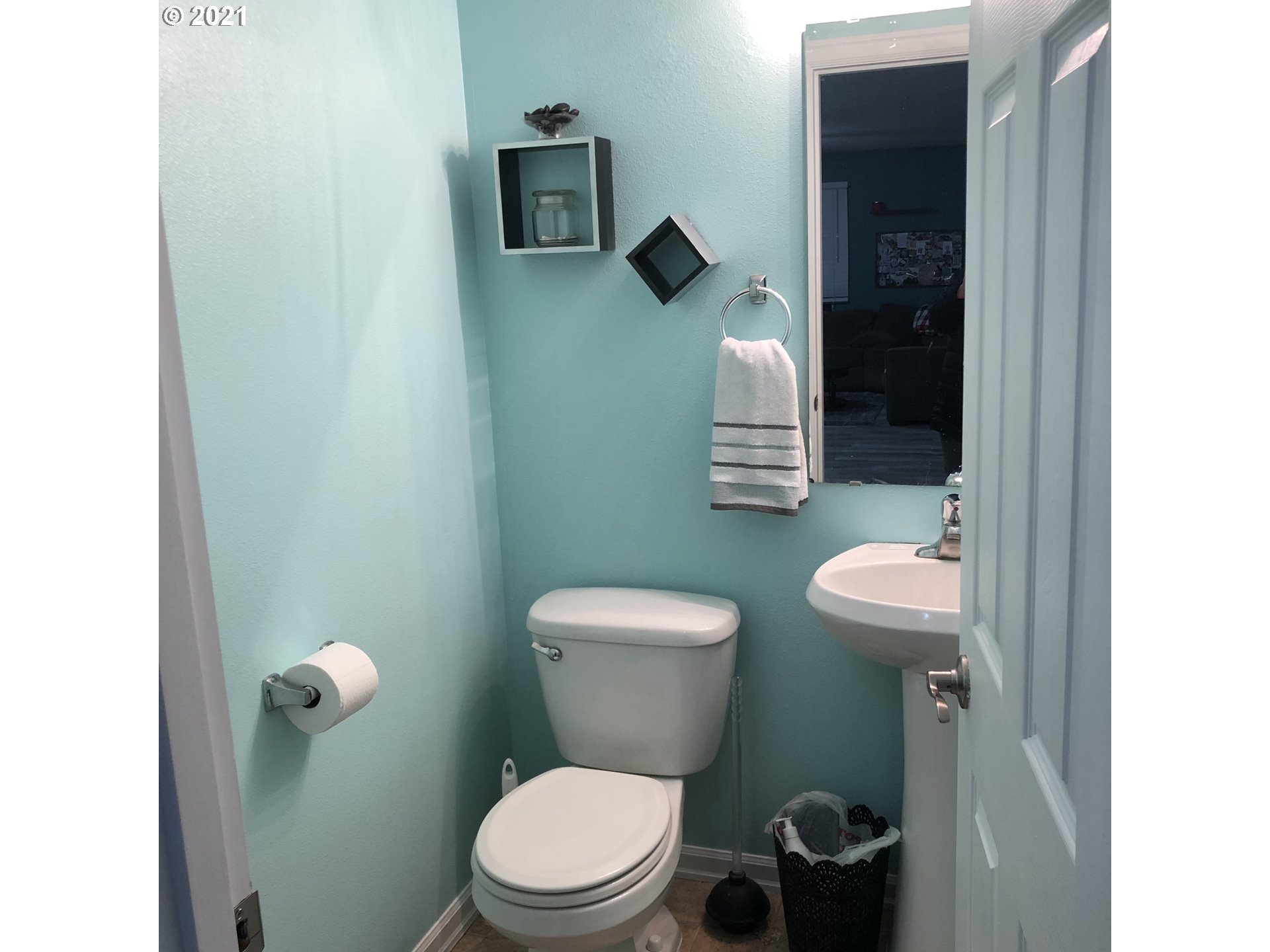 17105 Northeast 13th Place Ridgefield, WA 98642 - Photo 14 of 16 a white toilet sitting next to a bathroom sink