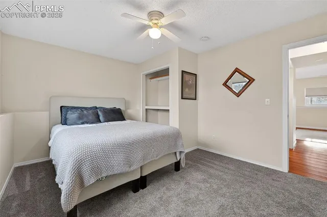 a bathroom with a toilet a sink and a mirror