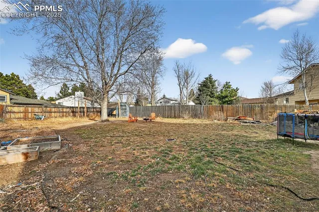 a view of a large house with a yard