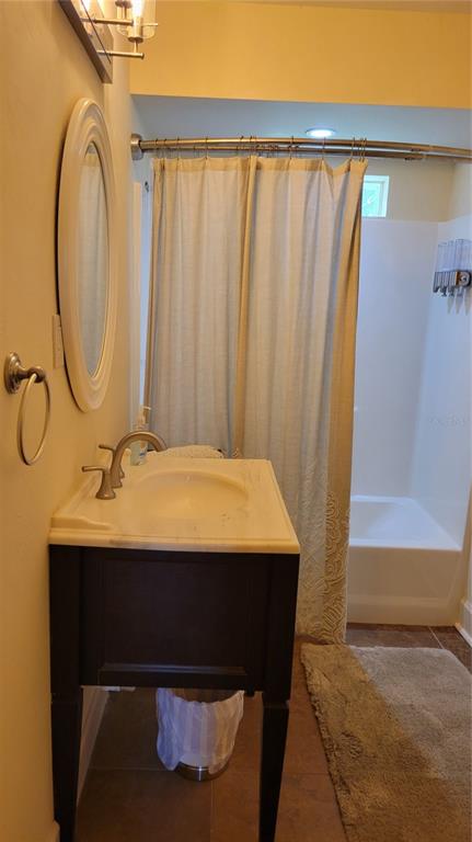 3932 Sunshine Avenue Sarasota, FL 34231 - Photo 13 of 17 a bathroom with a sink and a mirror