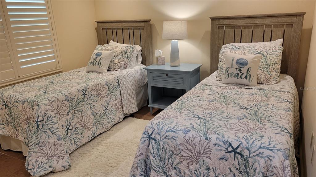 3932 Sunshine Avenue Sarasota, FL 34231 - Photo 14 of 17 a bedroom with a bed and a night stand