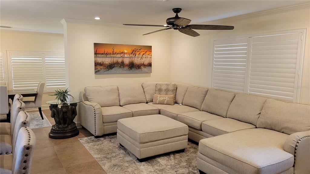 3932 Sunshine Avenue Sarasota, FL 34231 - Photo 9 of 17 a living room with furniture and a flat screen tv