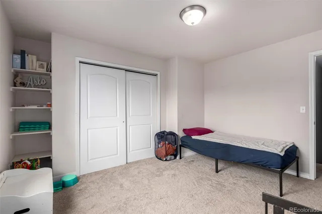 a bedroom with furniture and natural light