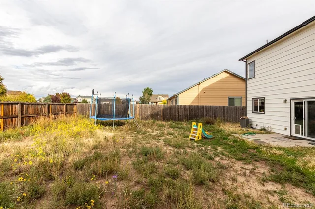 a view of a backyard of the house