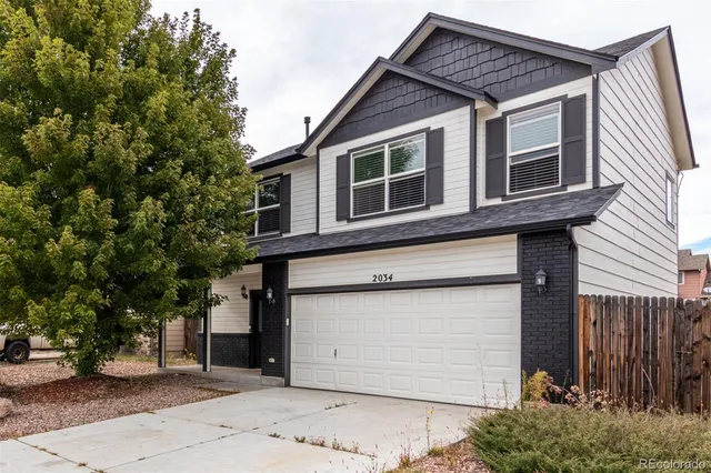 a view of a house with a garage