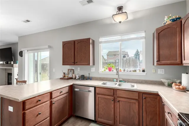 a kitchen with a sink and a window