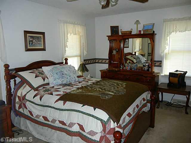 1258 Leake Memorial Church Road Germanton, NC 27019 - Photo 10 of 16 Master Bedroom. Spacious master bedroom with a double closet, ceiling fan and private bath.