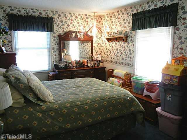 1258 Leake Memorial Church Road Germanton, NC 27019 - Photo 11 of 16 2nd Bedroom. Large 2nd bedroom with overhead lighting. 2 hall closets for linens and hanging coats.
