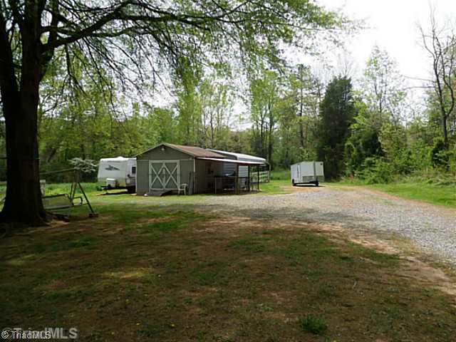 1258 Leake Memorial Church Road Germanton, NC 27019 - Photo 13 of 16 Outbuilding. Outbuilding/kennel for storage or pets.