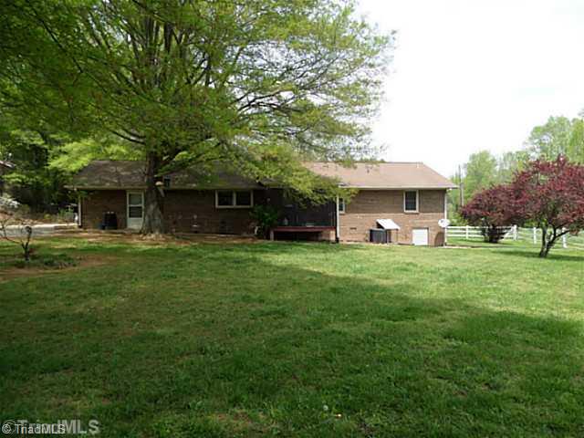 1258 Leake Memorial Church Road Germanton, NC 27019 - Photo 15 of 16 Exterior Back. Back view of the house showing the all brick house on a crawl space and nice level land.