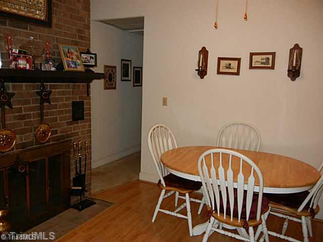 1258 Leake Memorial Church Road Germanton, NC 27019 - Photo 6 of 16 Breakfast. Cozy breakfast area with a masonry FP has 2 chimneys, ceiling fan and door to the screened porch.