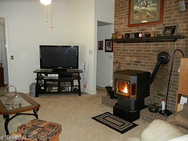 1258 Leake Memorial Church Road Germanton, NC 27019 - Photo 9 of 16 Living Room. Another view of the living room showing the glowing warmth of the pellet stove.