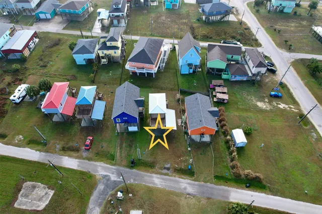 an aerial view of house with yard