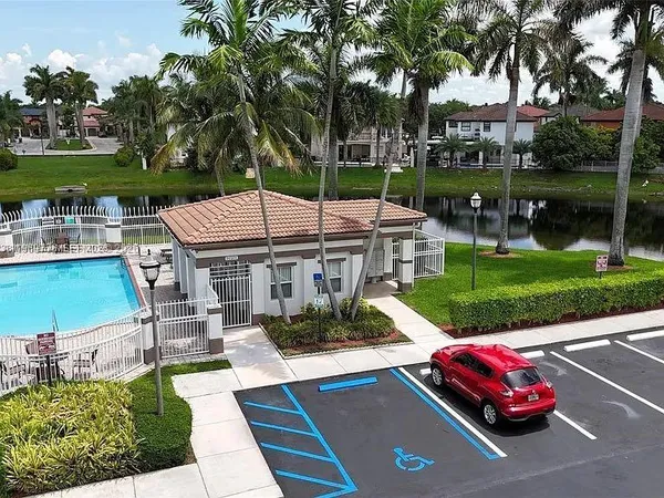 a view of a patio with couches table and chairs with a yard