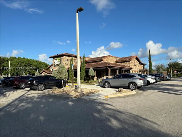 a view of a street with cars on road