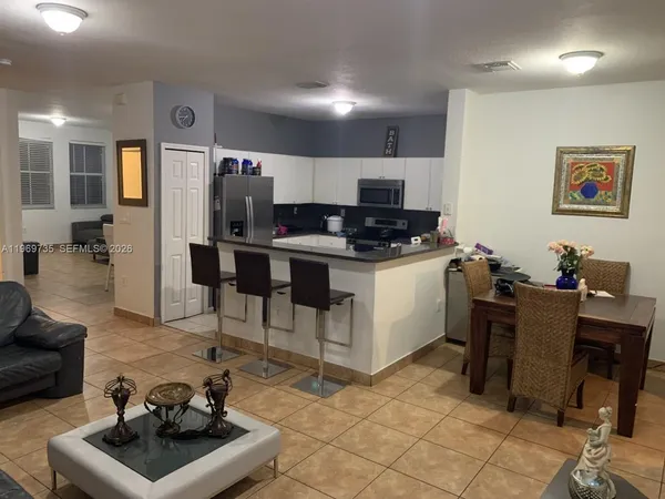 a kitchen with a sink and a stove top oven
