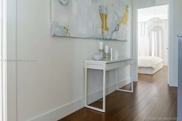 a view of cabinets and wooden floor