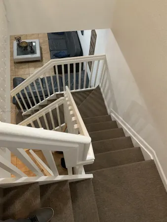 a view of entryway and kitchen