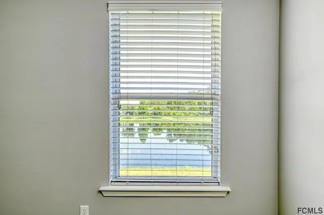 a view of a room that has a window