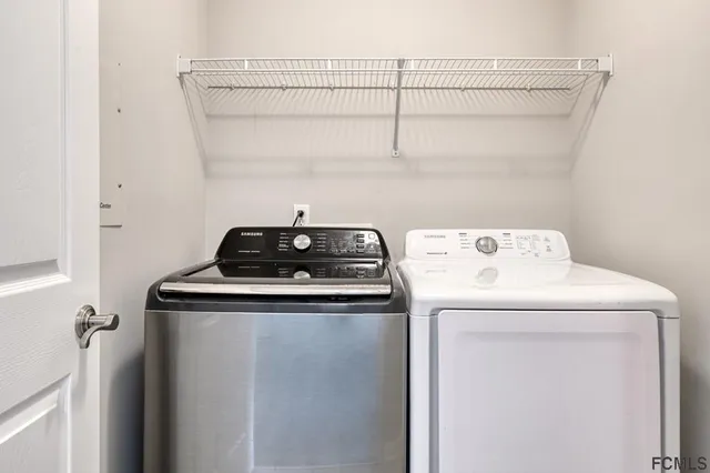 a utility room with dryer and washer