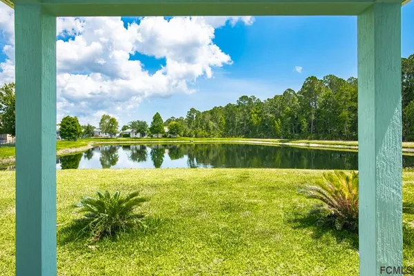 a view of a lake with a big yard