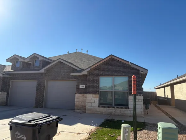 a front view of a house with yard