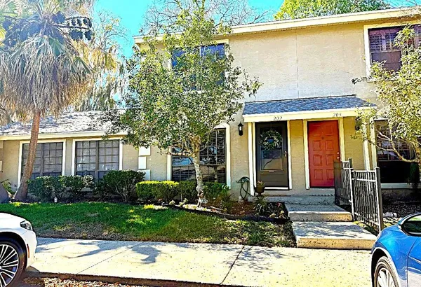 a bathroom with a toilet and mirror